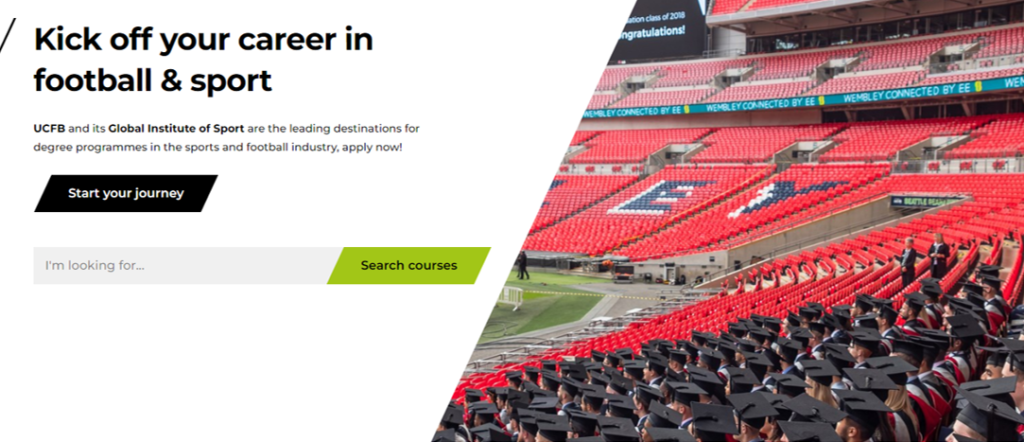 Image from the UCFB website showing graduates sitting in Wembley stadium wearing their caps and gowns.